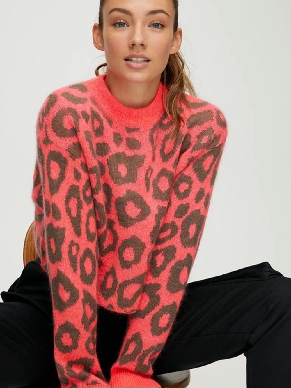 Aritzia Tna Utica Sweater in the Soot/Dayglow Pink colorway